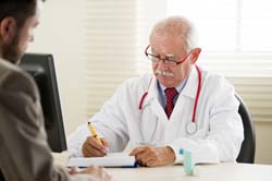 doctor writing prescription