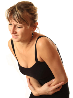 Woman with stomach pain 250w Woman with stomach pain
