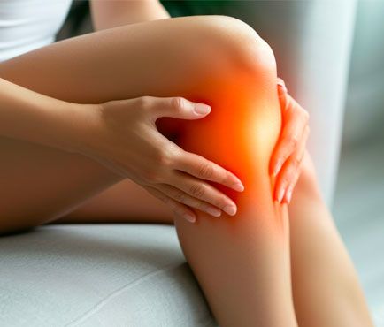 woman touching knee