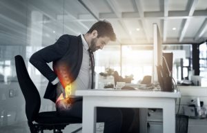 businessman suffering from spinal pain